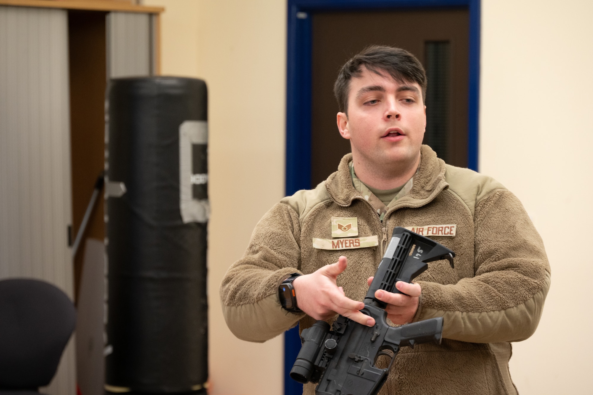 U.S. Air Force Staff Sgt. Leonard Myers, 423rd Security Forces Squadron Armory non-commissioned officer in charge, demonstrates parts of a rifle