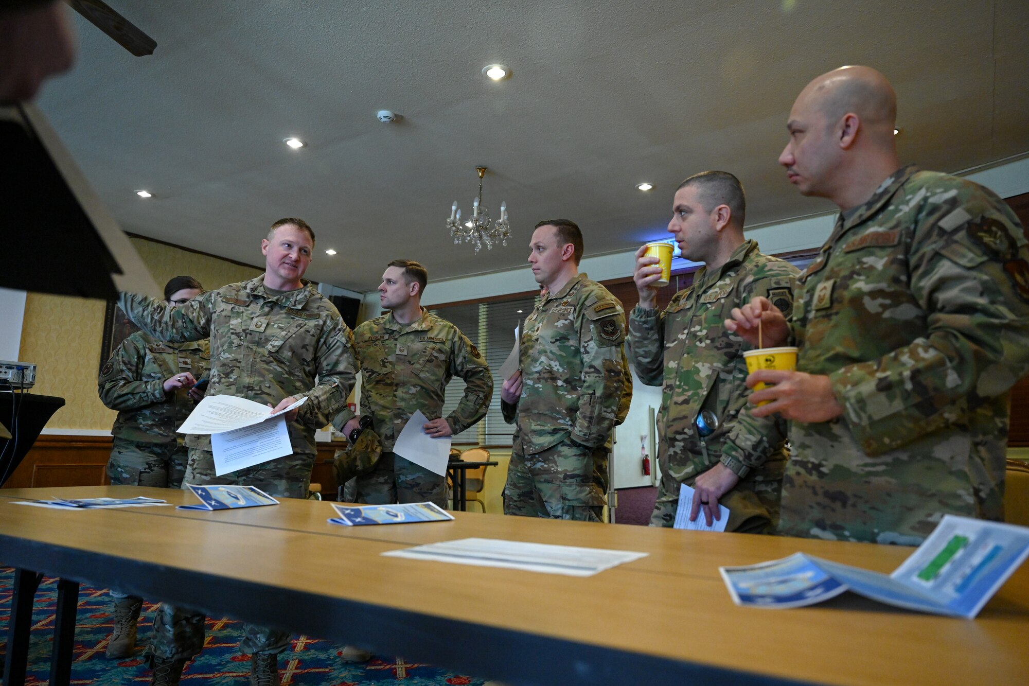 Airmen assigned to the 521st Air Mobility Operations Wing prepare to begin speed mentoring at the Armstrong Club on Vogelweh Military Complex, Germany, Feb. 19, 2025.