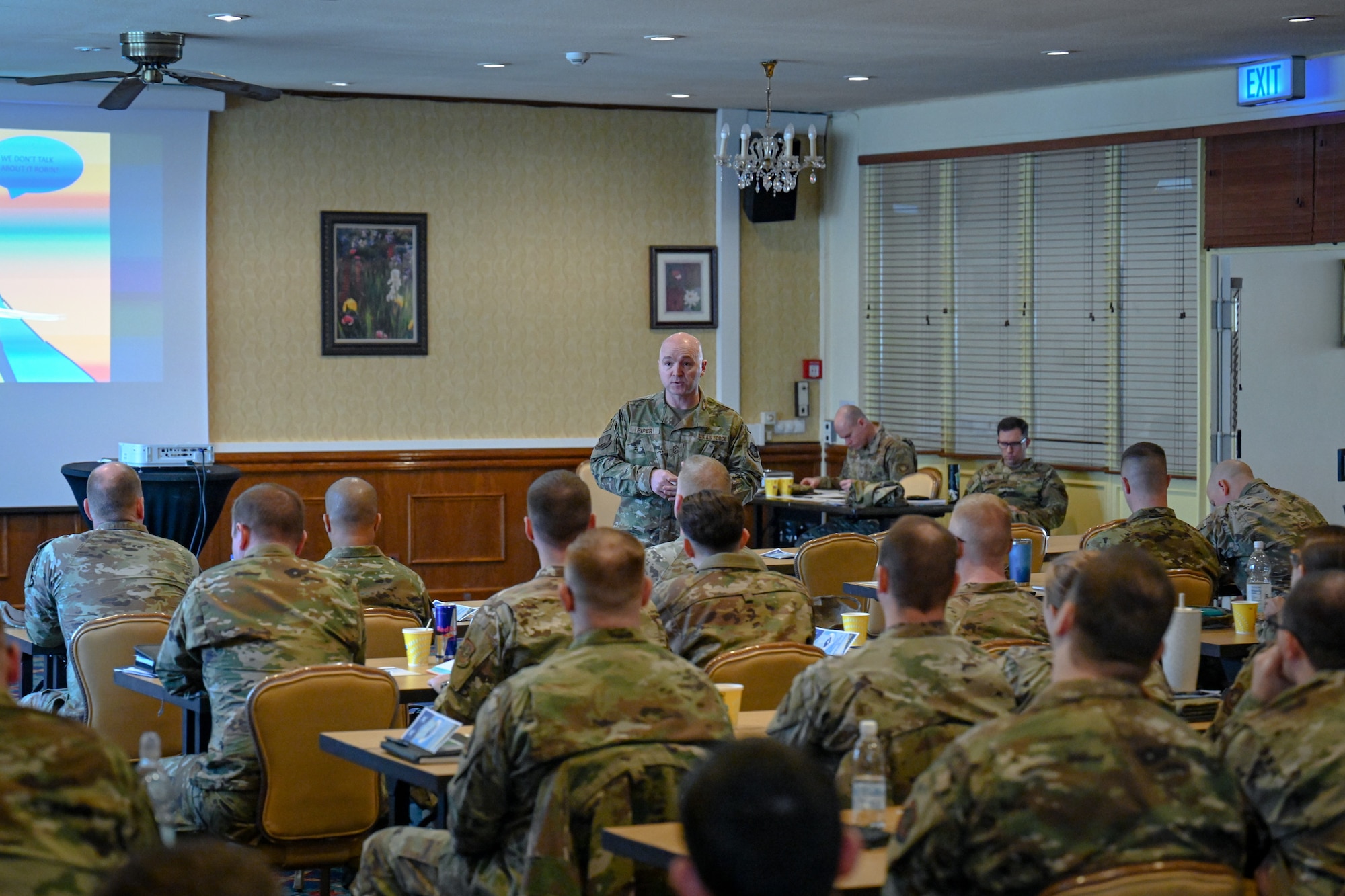 Chief Master Sgt. Scott Piper, 521st Air Mobility Operations Wing command chief, briefs Airmen assigned to the 521 AMOW about advice on enlisted promotions during a professional development seminar at the Armstrong Club on Vogelweh Military Complex, Germany, Feb. 19, 2025. (U.S. Air Force photo by Staff Sgt. Joshua T. Crossman)