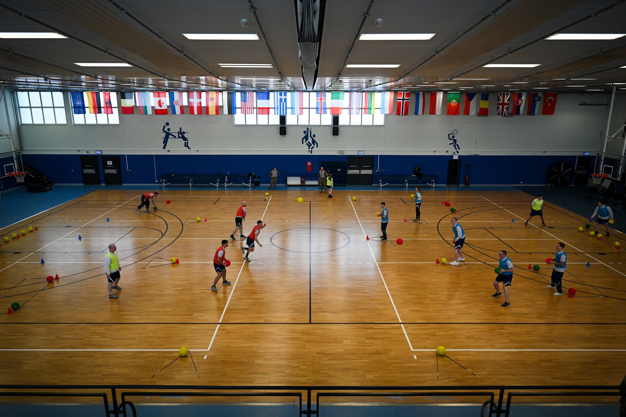Airmen assigned to the 521st Air Mobility Operations Wing begin a game of FLEX Ball at the Vogelweh Fitness Center on Kapaun Air Station, Germany, Feb. 20, 2025. (U.S. Air Force photo by Staff Sgt. Joshua T. Crossman)