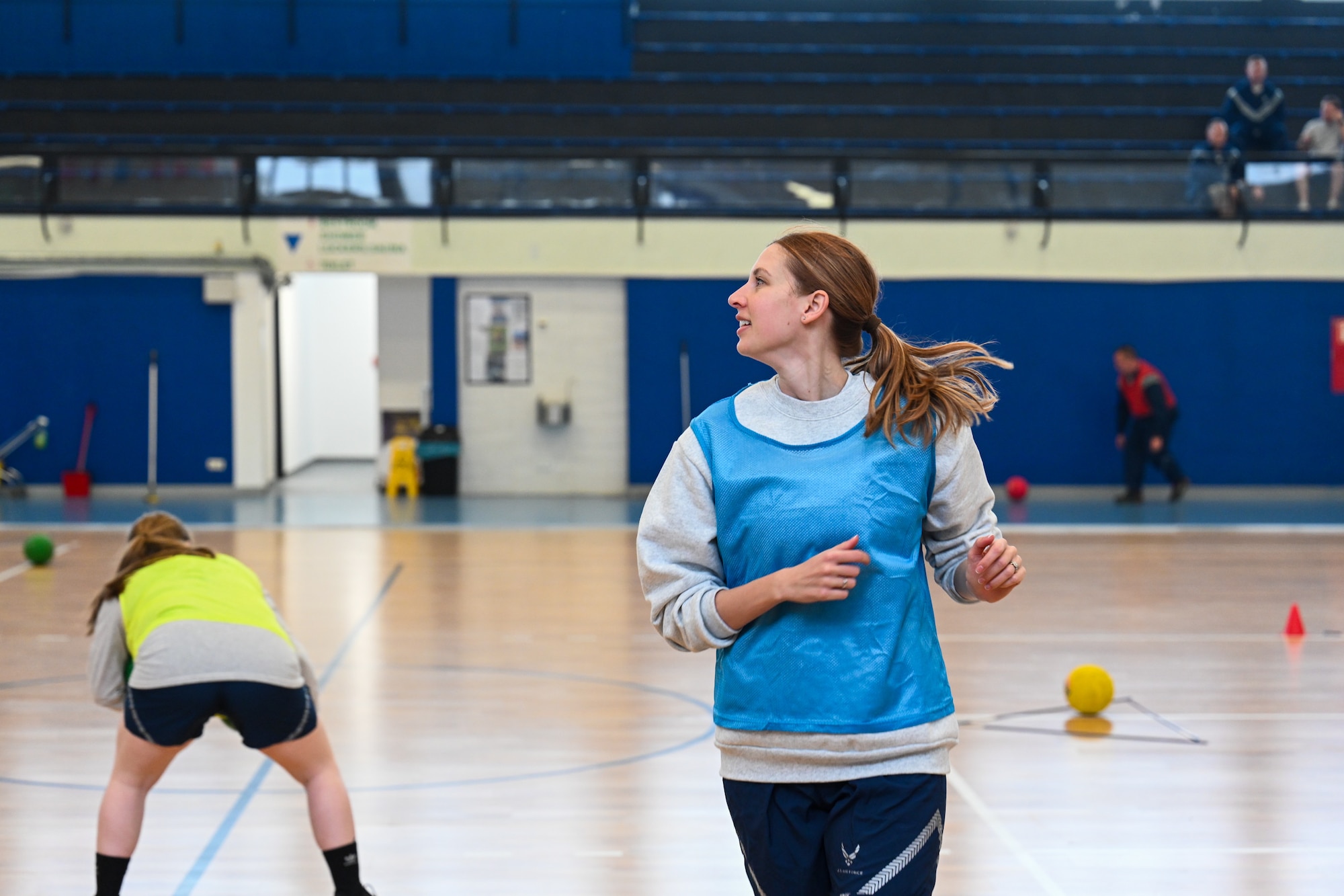 Maj. Rachel Smith, 721st Aerial Port Squadron director of operations, runs during a game of FLEX Ball at the Vogelweh Fitness Center on Kapaun Air Station, Germany, Feb. 20, 2025.