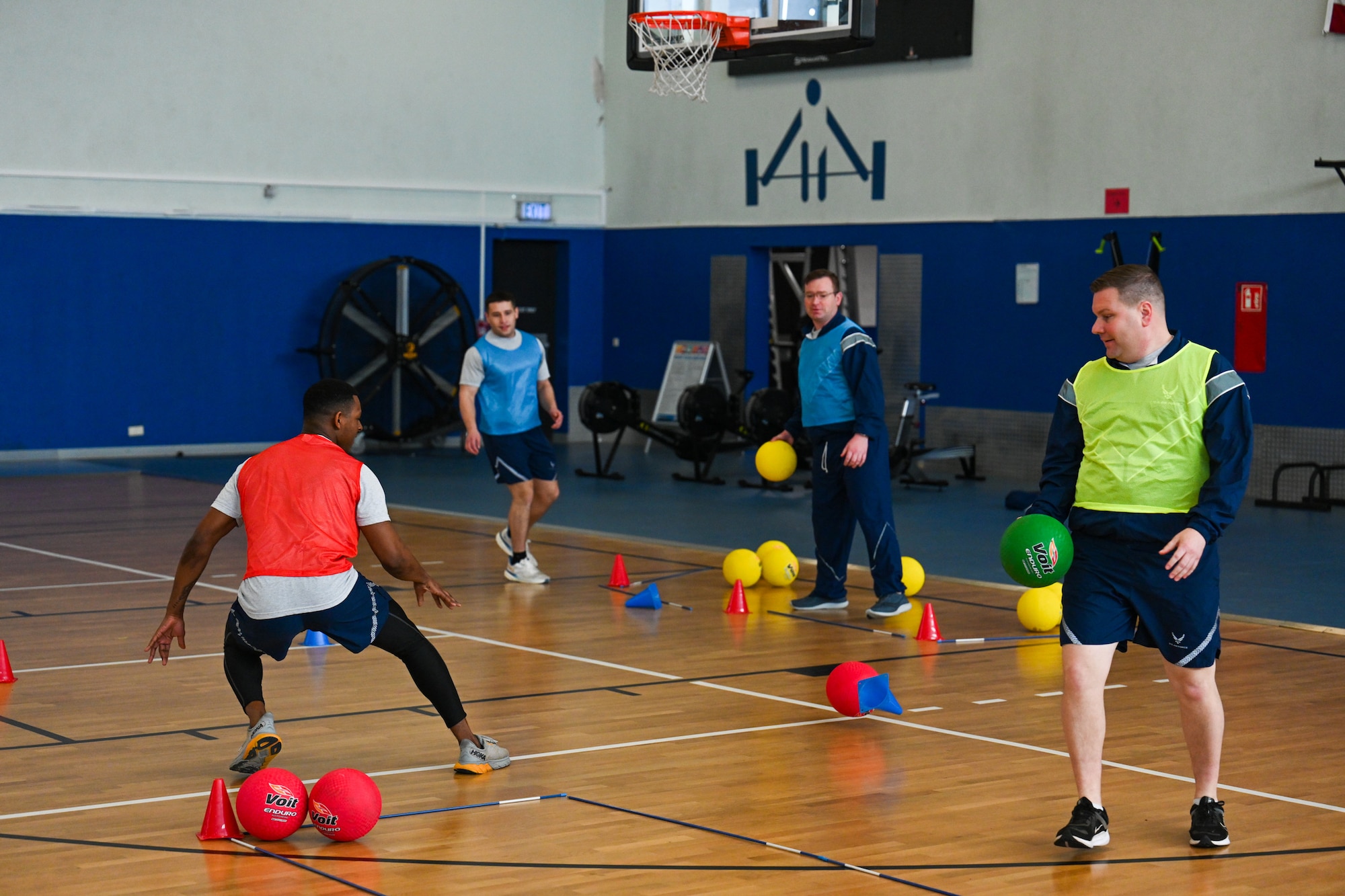 Airmen assigned to the 521st Air Mobility Operations Wing participate in a game of FLEX Ball at the Vogelweh Fitness Center on Kapaun Air Station, Germany, Feb. 20, 2025.