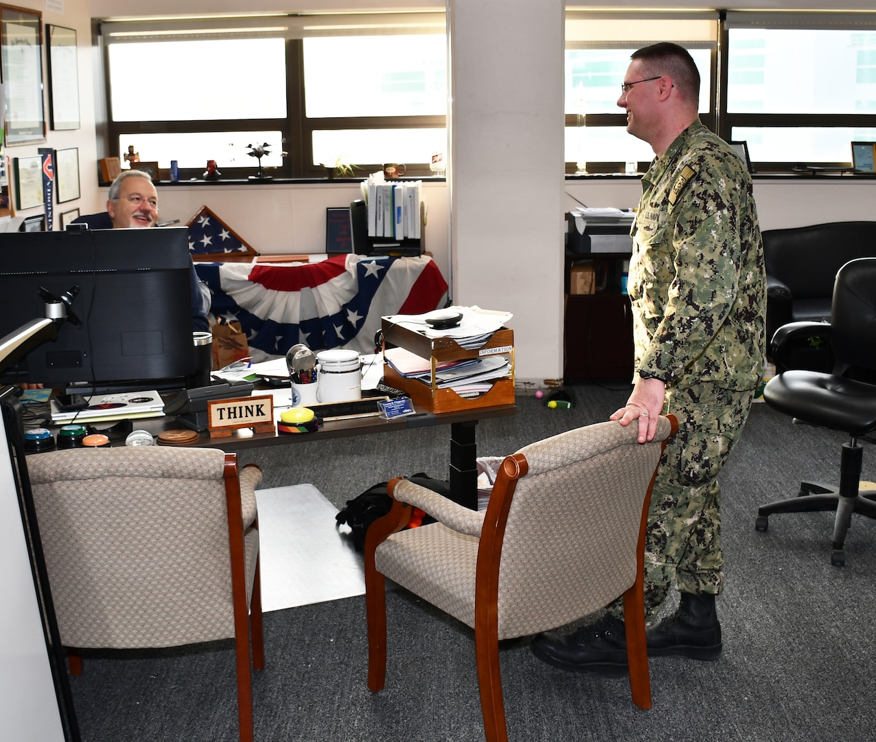Norfolk Navy Shipyard’s Business and Strategic Planning Officer (Code 1200) Cmdr. Brian Banazwki discusses upcoming projects with Deputy Business and Strategic Planner Officer (Code 1201) George Fitzgerald.