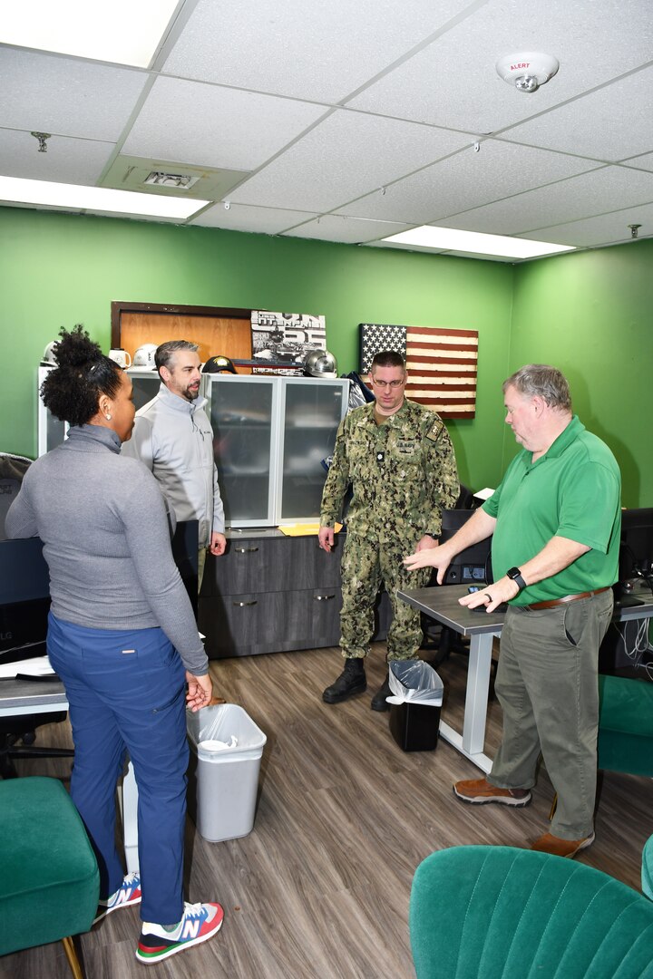 (From Left to Right) Norfolk Naval Shipyard’s Business and Strategic Planning Office (Code 1200N) Deputy Nuclear Business Manager Chrystal Slade, Nuclear Branch Manager Richard Epperson, Business and Strategic Planning Officer (Code 1200) Cmdr. Brian Banazwki and Nuclear Business Manager (Code 1209.3) David Braxton are discussing Modifications and Additions to Reach Plant Facilities (MARF).