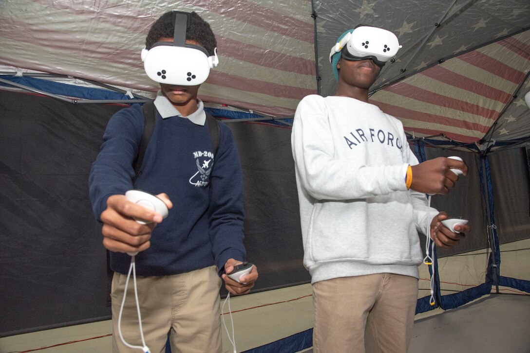 Air Force Junior ROTC cadets from Dr. Henry A. Wise High School fly aircraft in a virtual reality simulator during the Seventh Annual Aerospace Summit at Joint Base Andrews, Md., March 4, 2025. Wise High School was one of eight that participated in the event, which is designed to inspire students to pursue military engineering and aviation careers. (U.S. Air Force photo by Patrick Griffith)