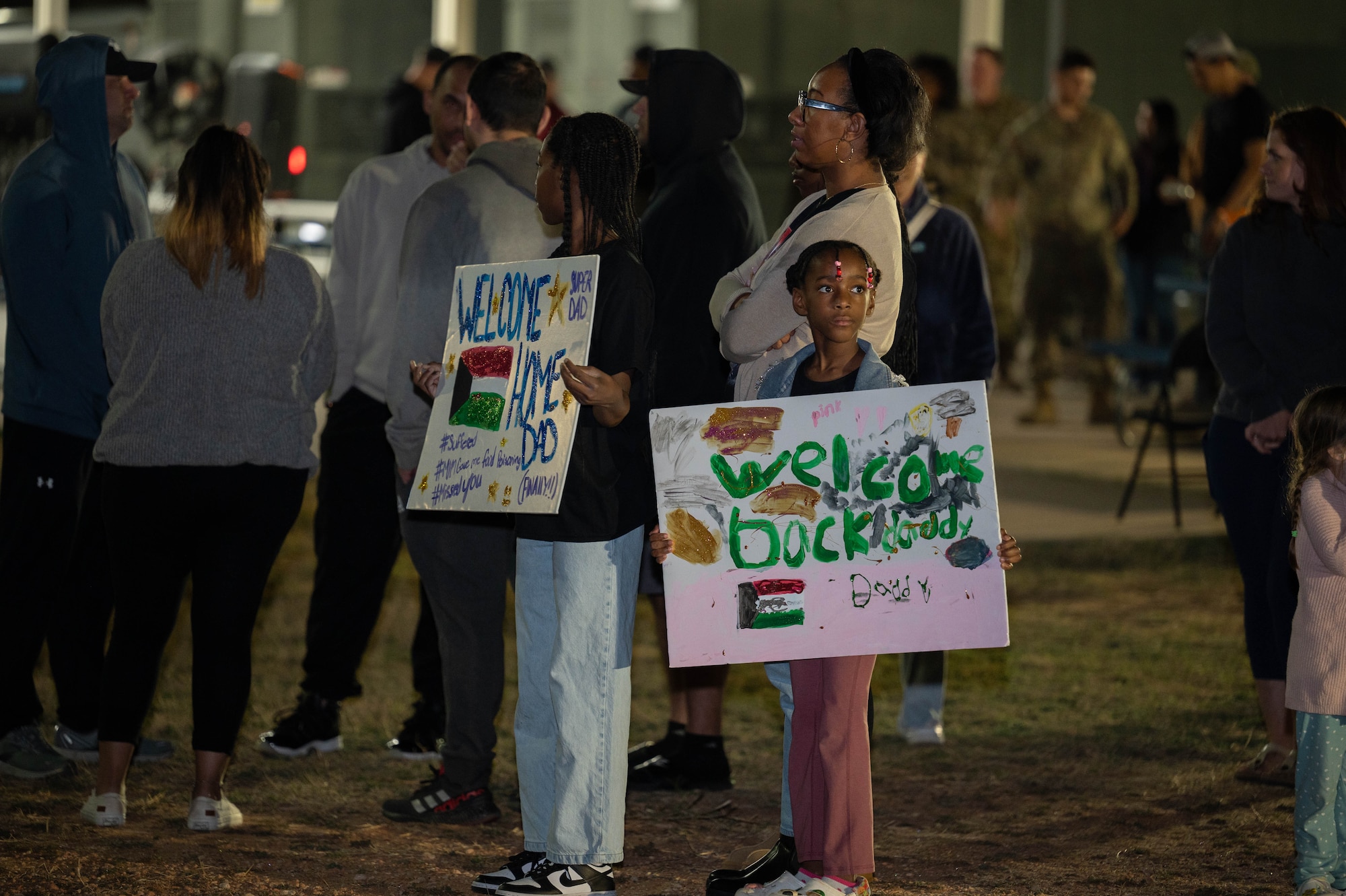 Friends and family welcome home Airmen from the 317th Airlift Wing at Dyess Air Force Base, Texas, March 9, 2025. The 317th supports combat-delivery through tactical airland and airdrop operations as well as humanitarian efforts and aeromedical evacuation. (U.S. Air Force photo by Senior Airman Alondra Cristobal Hernandez)