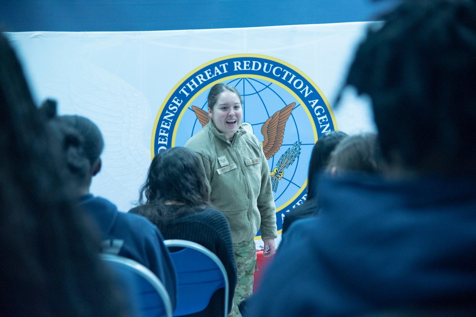 U.S. Air Force Staff Sgt. Lemy L. Davenport, 316th Inpatient Squadron, speaks to local high school students about the Defense Threat Reduction Agency mission during the Seventh Annual Aerospace Summit at Joint Base Andrews, Md., March 4, 2025.  DTRA’s mission is to deter, prevent, reduce, counter and prevail against weapons of mass destruction against the United States and its allies. (U.S. Air Force photo by Patrick Griffith)