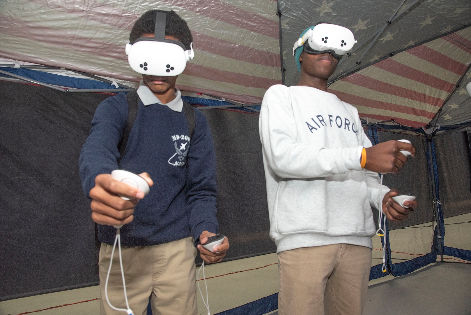 Air Force Junior ROTC cadets from Dr. Henry A. Wise High School fly aircraft in a virtual reality simulator during the Seventh Annual Aerospace Summit at Joint Base Andrews, Md., March 4, 2025. Wise High School was one of eight that participated in the event, which is designed to inspire students to pursue military engineering and aviation careers. (U.S. Air Force photo by Patrick Griffith)