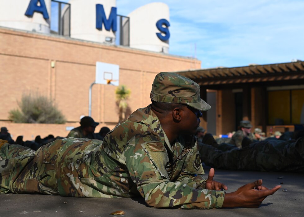 An Angelo State University ROTC Air Force Detachment 847 cadet lays prone and waits for orders at ASU, San Angelo, Texas, Feb. 26, 2025. 17th Security Forces Squadron Defenders trained the cadets to respond to hostiles together and improved their communication. (U.S. Air Force photo by Staff Sgt. Ethan Sherwood)
