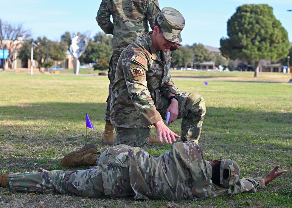 An Angelo State University ROTC Air Force Detachment 847 cadet checks on his wingman after an attack during combat tactics training at Angelo State University, San Angelo, Texas, Feb. 26, 2025. Cadets performed patrols, responded to simulated threats and honed their ability to operate under pressure. (U.S Air Force photo by Staff Sgt. Ethan Sherwood)
