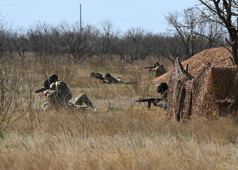 Angelo State University ROTC Air Force Detachment 847 cadets perform Tactical Combat Casualty Care on a fallen wingman during a search and rescue operation at the field training exercise on Goodfellow Air Force Base, Texas, March 7, 2025. Cadets learned life-saving techniques from the 17th Medical Group and applied them during their field training exercise. (U.S. Air Force Staff Sgt. Nathan Call)