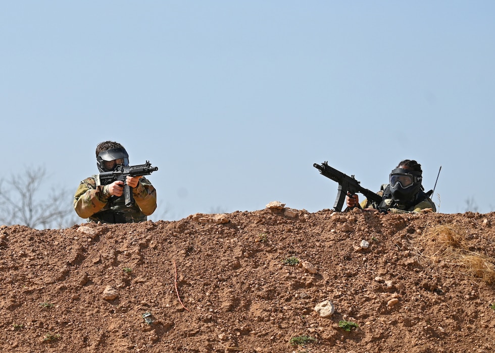 Angelo State University ROTC Air Force Detachment 847 cadets hold a berm against enemy forces during their search and rescue operation at the field training exercise on Goodfellow Air Force Base, Texas, March 7, 2025. 17th Security Forces Squadron Defenders taught the cadets defensive and offensive tactics, which they used to pass their exercise. (U.S. Air Force photo by Staff Sgt. Nathan Call)