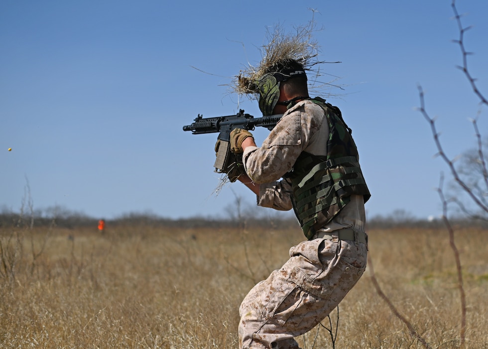 A U.S. Marine assigned to Goodfellow Air Force Base ambushes Angelo State University ROTC Air Force Detachment 847 cadets during the search and rescue operation at the field training exercise on Goodfellow AFB, Texas, March 7, 2025. Marines simulated opposing forces and utilized guerilla tactics the cadets may encounter during deployment. (U.S. Air Force photo by Staff Sgt. Ethan Sherwood)