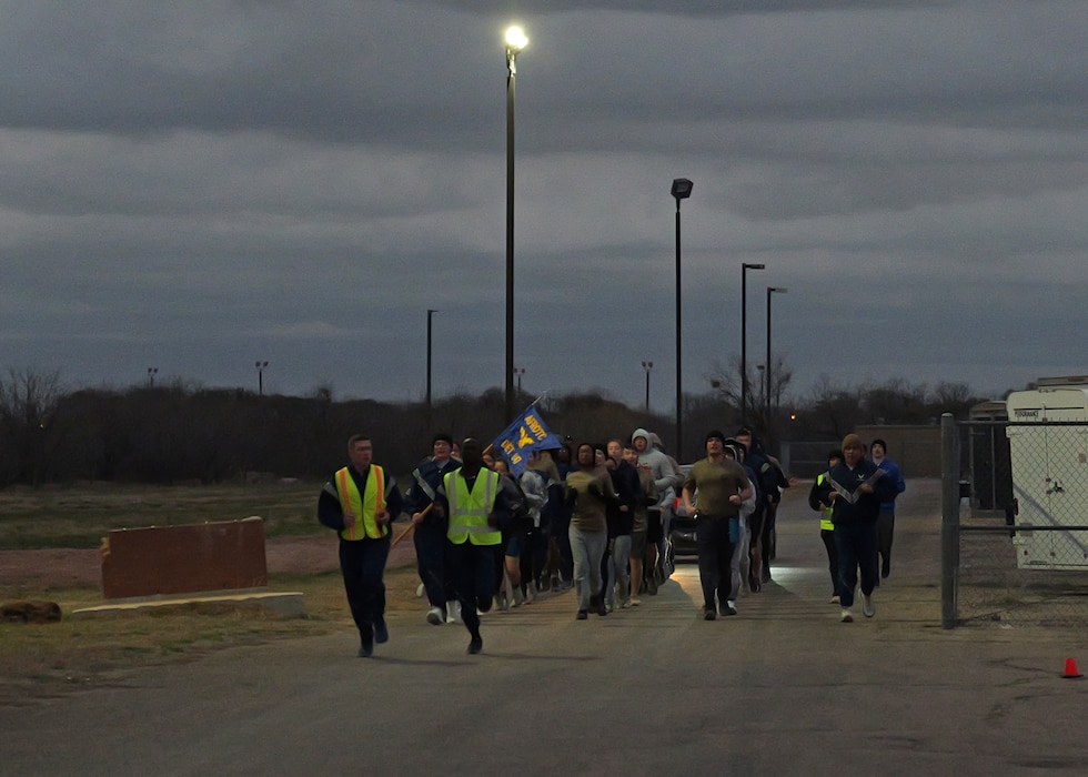Angelo State University ROTC Air Force Detachment 847 cadets run in formation during their morning physical training on Goodfellow Air Force Base, Texas, March 8, 2025. Cadets perform PT together to stay physically fit and improve camaraderie. (U.S. Air Force photo by Staff Sgt. Nathan Call)
