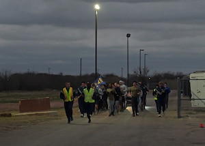 Angelo State University ROTC Air Force Detachment 847 cadets run in formation during their morning physical training on Goodfellow Air Force Base, Texas, March 8, 2025. Cadets perform PT together to stay physically fit and improve camaraderie. (U.S. Air Force photo by Staff Sgt. Nathan Call)