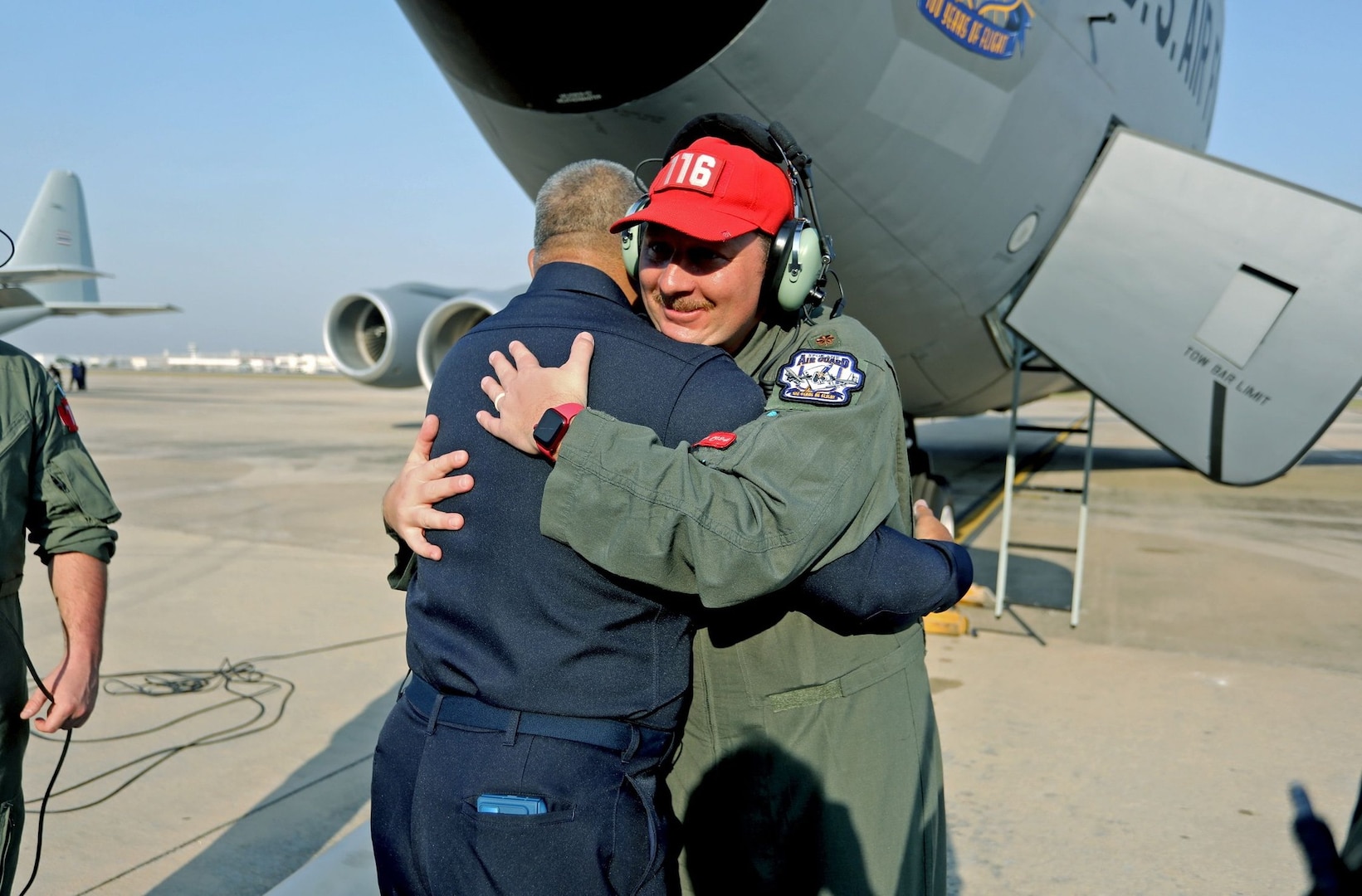 Royal Thai Air Force Group Captain Nat Kamintra hugs a member of the 116th Air Refueling Sqaudron, 141st Air Refueling Wing, before departing Don Muang Air Base, Bangkok, Thailand, March 10, 2025.