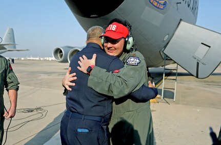 Royal Thai Air Force Group Captain Nat Kamintra hugs a member of the 116th Air Refueling Sqaudron, 141st Air Refueling Wing, before departing Don Muang Air Base, Bangkok, Thailand, March 10, 2025.