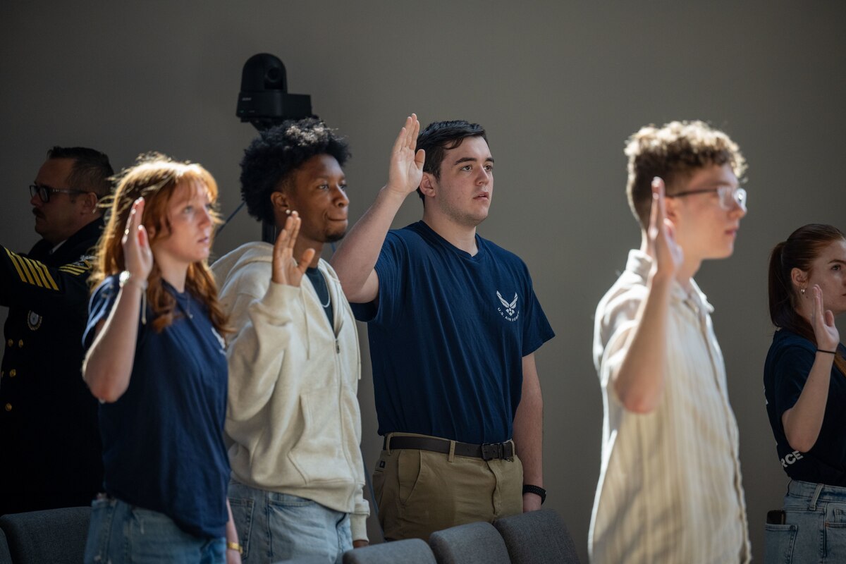 tudents stand and give the Oath of Enlistment at the Ohio Military Signing Day at the National Veterans Memorial Museum in Columbus, Ohio, March 11, 2025.