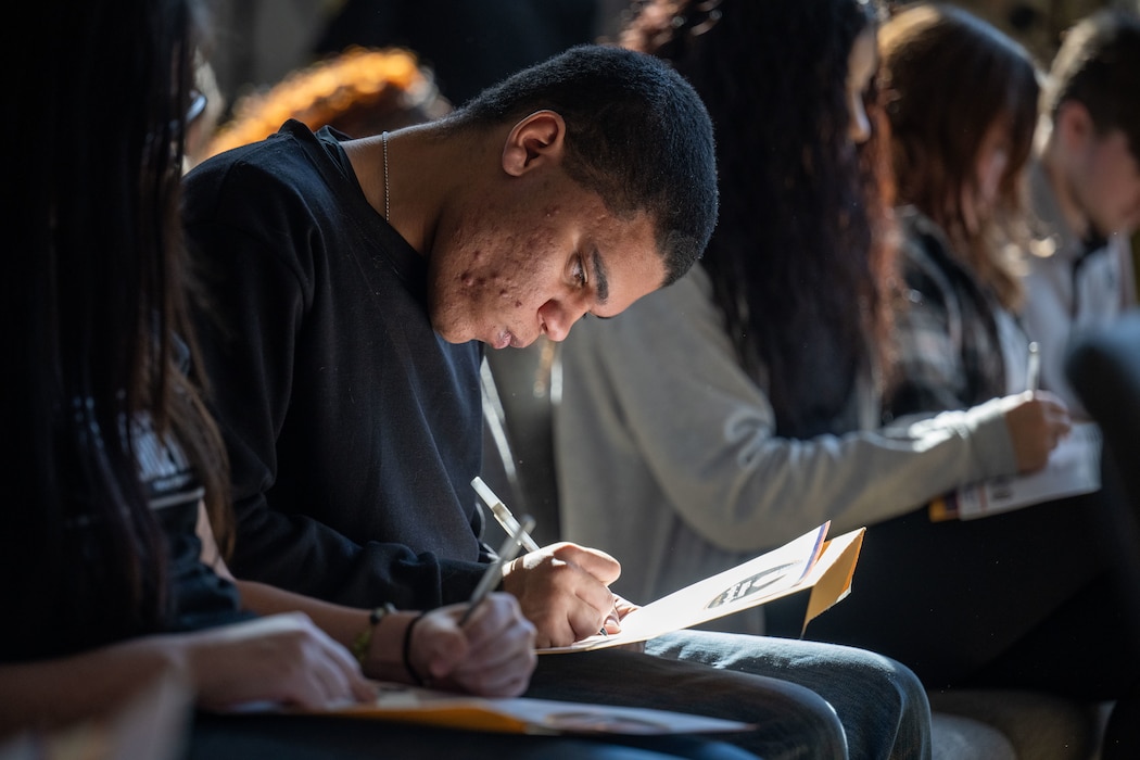 A future service member solidifies their commitment to the United States military with a signature at the Ohio Military Signing Day at the National Veterans Memorial Museum in Columbus, Ohio, March 11, 2025