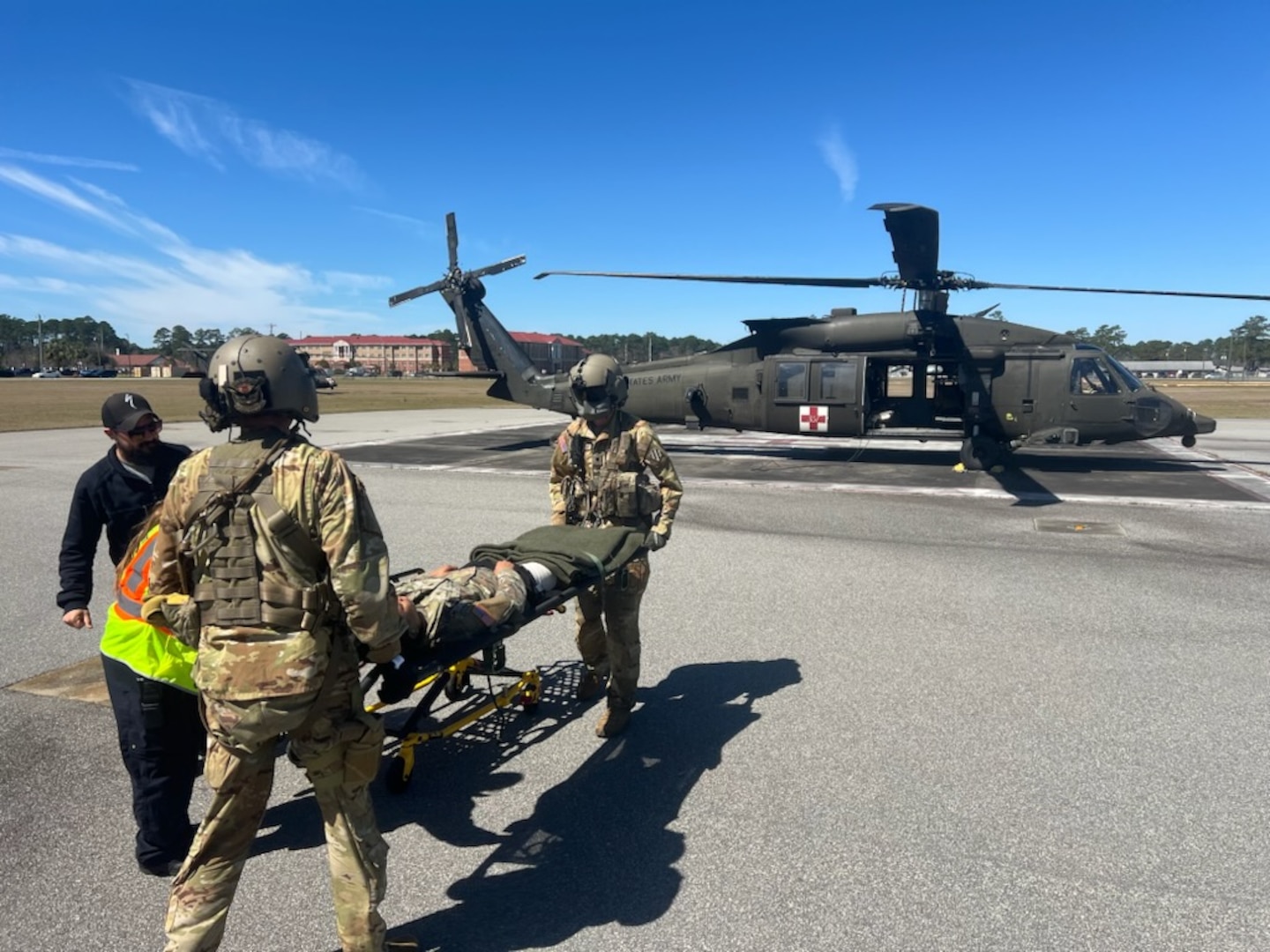 Fort Stewart Emergency Services and 3rd Combat Aviation Brigade medics transfer a simulated injured patient from 2nd Armored Brigade Combat Team between each other for transport to Winn Army Community Hospital emergency department for further care during a mass casualty exercise March 7. The exercise began with the armored brigade requesting aviation medical evacuation support. The two 3rd Infantry Division units participated in the capstone event for exercise Spartan Focus, one of the wickets in the armored brigade’s journey to being ready for its warfighter mission for deployment anytime, anywhere.