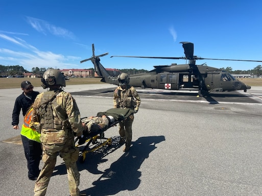 Fort Stewart Emergency Services and 3rd Combat Aviation Brigade medics transfer a simulated injured patient from 2nd Armored Brigade Combat Team between each other for transport to Winn Army Community Hospital emergency department for further care during a mass casualty exercise March 7. The exercise began with the armored brigade requesting aviation medical evacuation support. The two 3rd Infantry Division units participated in the capstone event for exercise Spartan Focus, one of the wickets in the armored brigade’s journey to being ready for its warfighter mission for deployment anytime, anywhere. Read more about the exercise at the link!