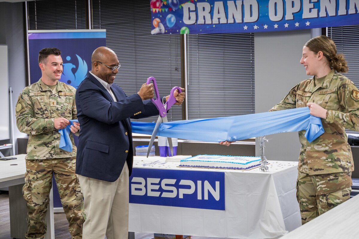 BES Program Executive Officer, Alvin Burse performing the ceremonial ribbon cutting.