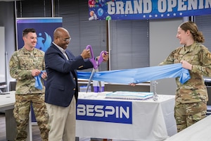 BES Program Executive Officer, Alvin Burse performing the ceremonial ribbon cutting.