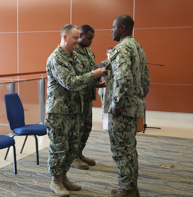 Navy Capt. Kenneth R. Basford, commanding officer of Expeditionary Medical Facility 150 Alpha, awards Master Chief Petty Officer Mario L. Lyons, outgoing command master chief for EMF 150 Alpha, with the Meritorious Service Medal in recognition of his outstanding service during his tour as senior enlisted leader for the command during a change of charge ceremony held March 12, 2025, at Naval Hospital Camp Pendleton. For 250 years, Navy Medicine has navigated the globe, actively rendering assistance to our warfighters by keeping them healthy and sustaining their readiness requirements to stay in the fight.