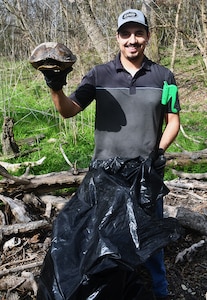 Warm weather brings out huge crowd for annual Basura Bash creek cleanup