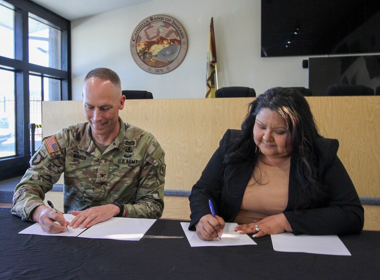 Col. Andrew Baker, U.S. Army Corps of Engineers Los Angeles District commander, left, joins Erica Schenk, tribal council chairwoman for the Cahuilla Band of Indians, right, Feb. 26 to sign a Feasibility Cost Share Agreement as part of an effort to restore the tribe’s hot springs at the Cahuilla Reservation near Anza, California.