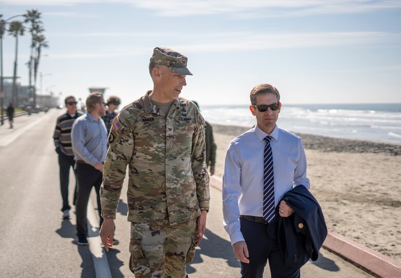 .S. Army Corps of Engineers Los Angeles District commander Col. Andrew Baker, center, talks with California’s 49th Congressional District Rep. Mike Levin during an onsite meeting Feb. 20 to discuss the status and future of shoreline mitigation in Oceanside, California.