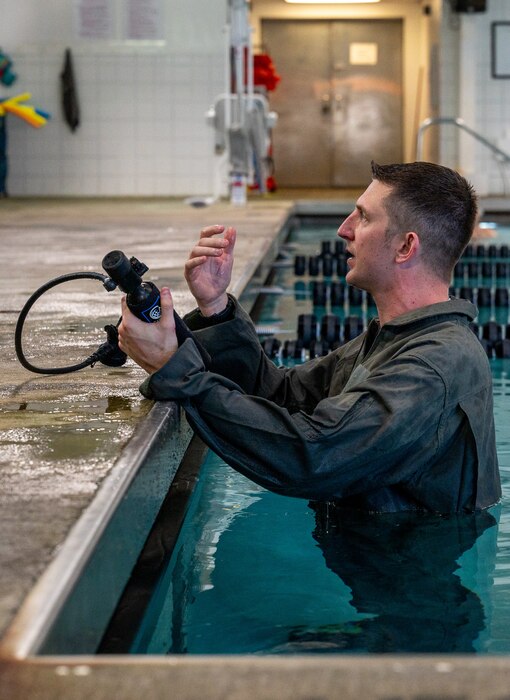 a man demonstrates how to use a breathing device
