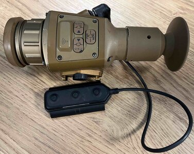 A piece of sight technology sits on a table.