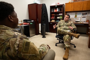 U.S. Air Force Maj. Charles Blizzard, Joint Task Force-Bravo chaplain, sits down with a 228th Aviation Battalion member to talk about what the chaplain office offers during a Resiliency Round Robin at Soto Cano Air Base, Honduras, March 11, 2025.