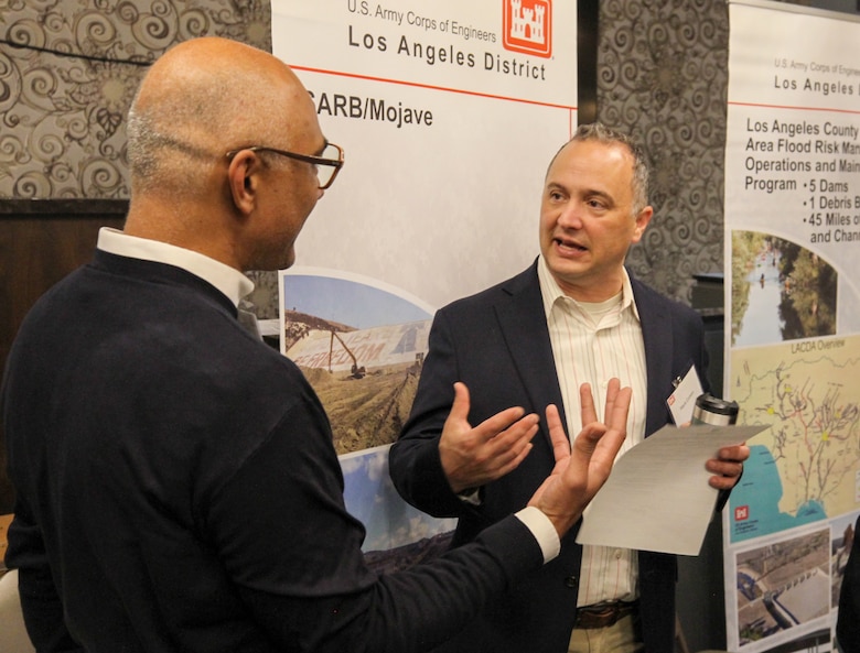 Mark Cohen, U.S. Army Corps of Engineers Los Angeles District Operations Division chief, right, talks with an attendee of the 2025 Business Opportunities Open House, which the LA District hosted March 6 in Montebello, California.