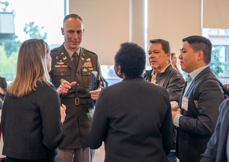 Col. Andrew Baker, U.S. Army Corps of Engineers Los Angeles District commander, second from left, speaks with attendees of the 2025 Business Opportunities Open House, which the LA District hosted March 6 in Montebello, California.