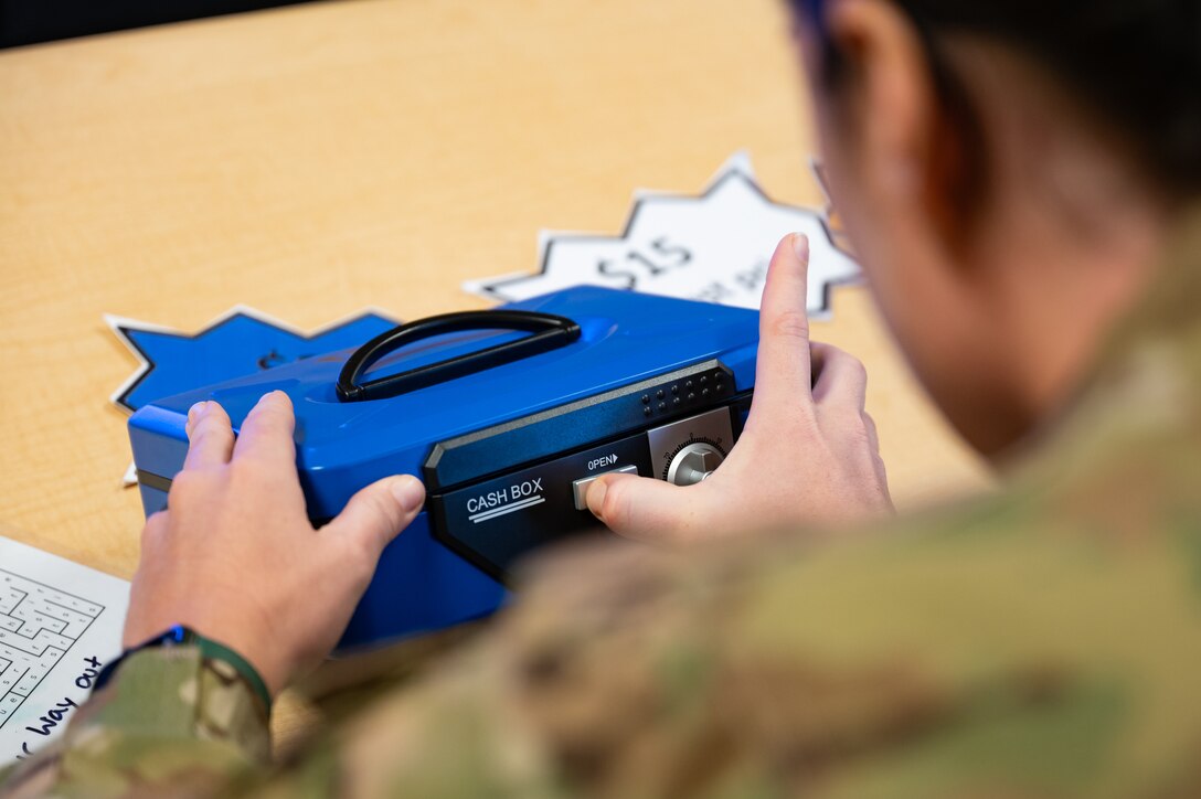 A 228th Aviation Battalion member unlocks a box while completing a challenge room during a Resiliency Round Robin at Soto Cano Air Base, Honduras, March 11, 2025.