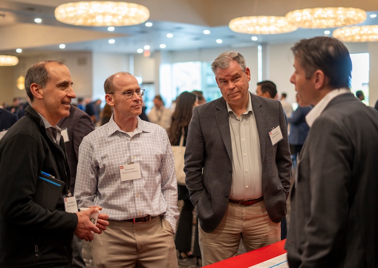 Patrick McKinley, U.S. Army Corps of Engineers Los Angeles District Mega Projects Division chief, right, talks with attendees of the 2025 Business Opportunities Open House, which the LA District hosted March 6 in Montebello, California.