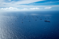 Multinational ships sail in formation July 22, off the coast of Hawaii during Exercise Rim of the Pacific (RIMPAC) 2024. Twenty-nine nations, 40 surface ships, three submarines, 14 national land forces, more than 150 aircraft and 25,000 personnel are participating in RIMPAC in and around the Hawaiian Islands, June 27 to Aug. 1.