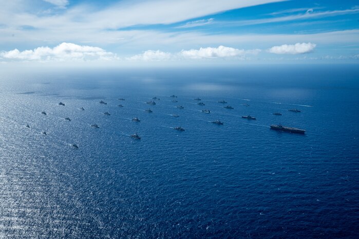 Multinational ships sail in formation July 22, off the coast of Hawaii during Exercise Rim of the Pacific (RIMPAC) 2024. Twenty-nine nations, 40 surface ships, three submarines, 14 national land forces, more than 150 aircraft and 25,000 personnel are participating in RIMPAC in and around the Hawaiian Islands, June 27 to Aug. 1.