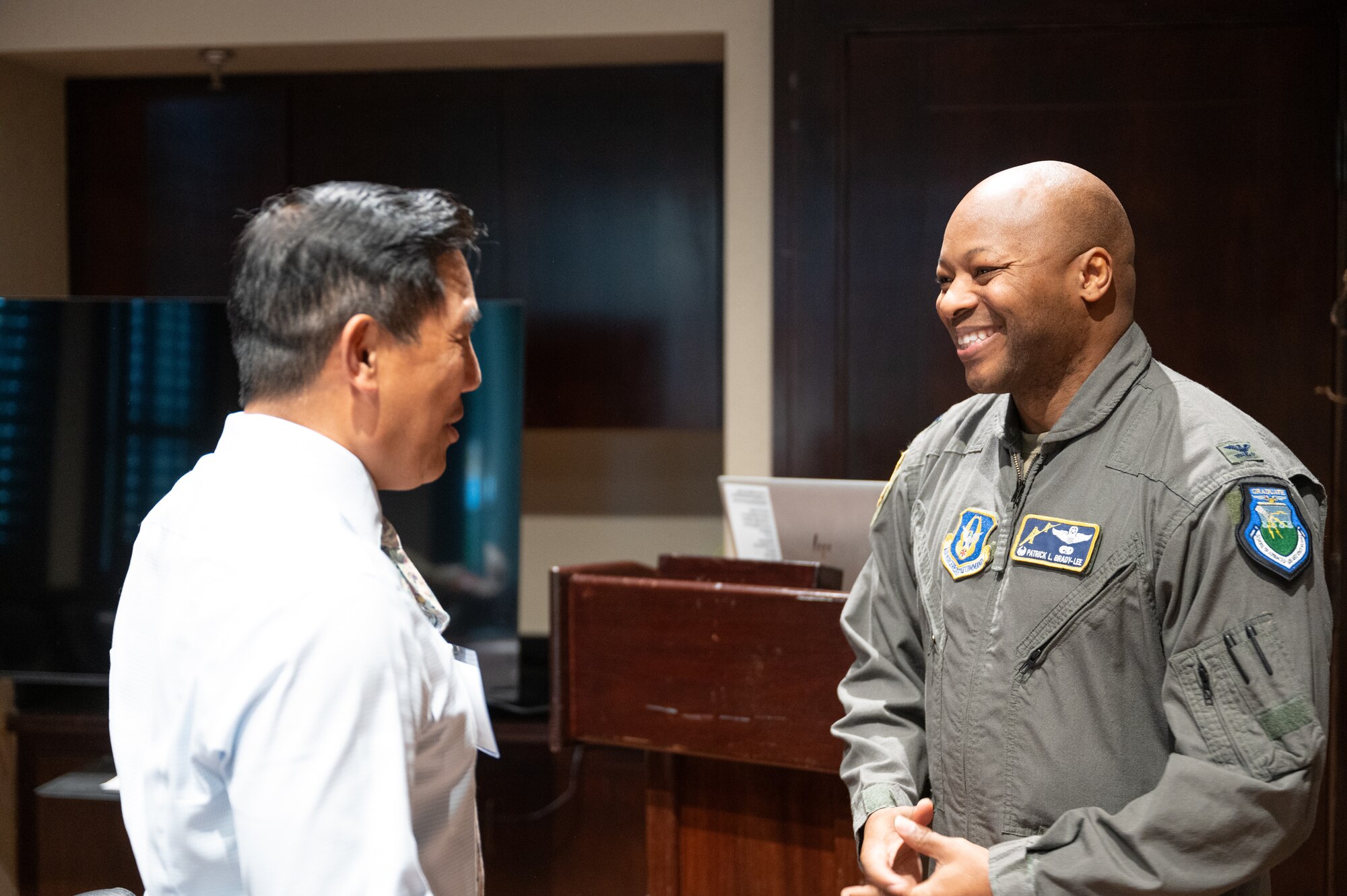 Col. Brady-Lee speaks with Jeromy Peralta at the Honorary Commander Informal Meet and Greet.
