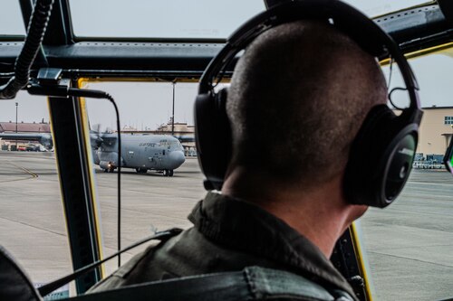 Cockpit view of a C-130J aircraft taxiing.