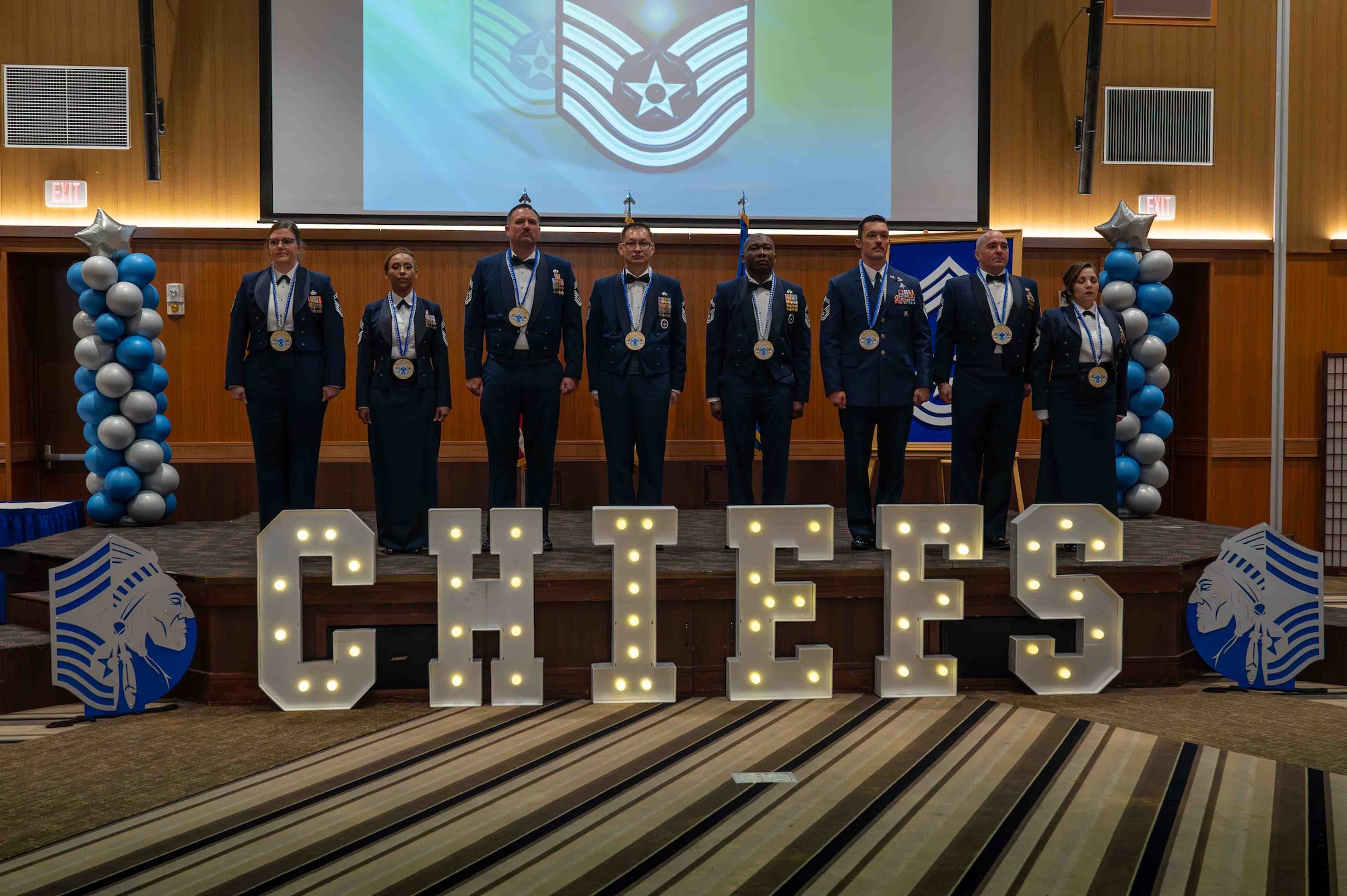 Chief inductees stand at attention for a group photo