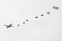 Japan Ground Self-Defense Force paratroopers assigned to the 1st Airborne Brigade descend from a U.S. Air Force C-130J Super Hercules assigned to the 36th Airlift Squadron over JGSDF East Fuji Maneuver Area, Japan, March 4, 2025, during Airborne 25.