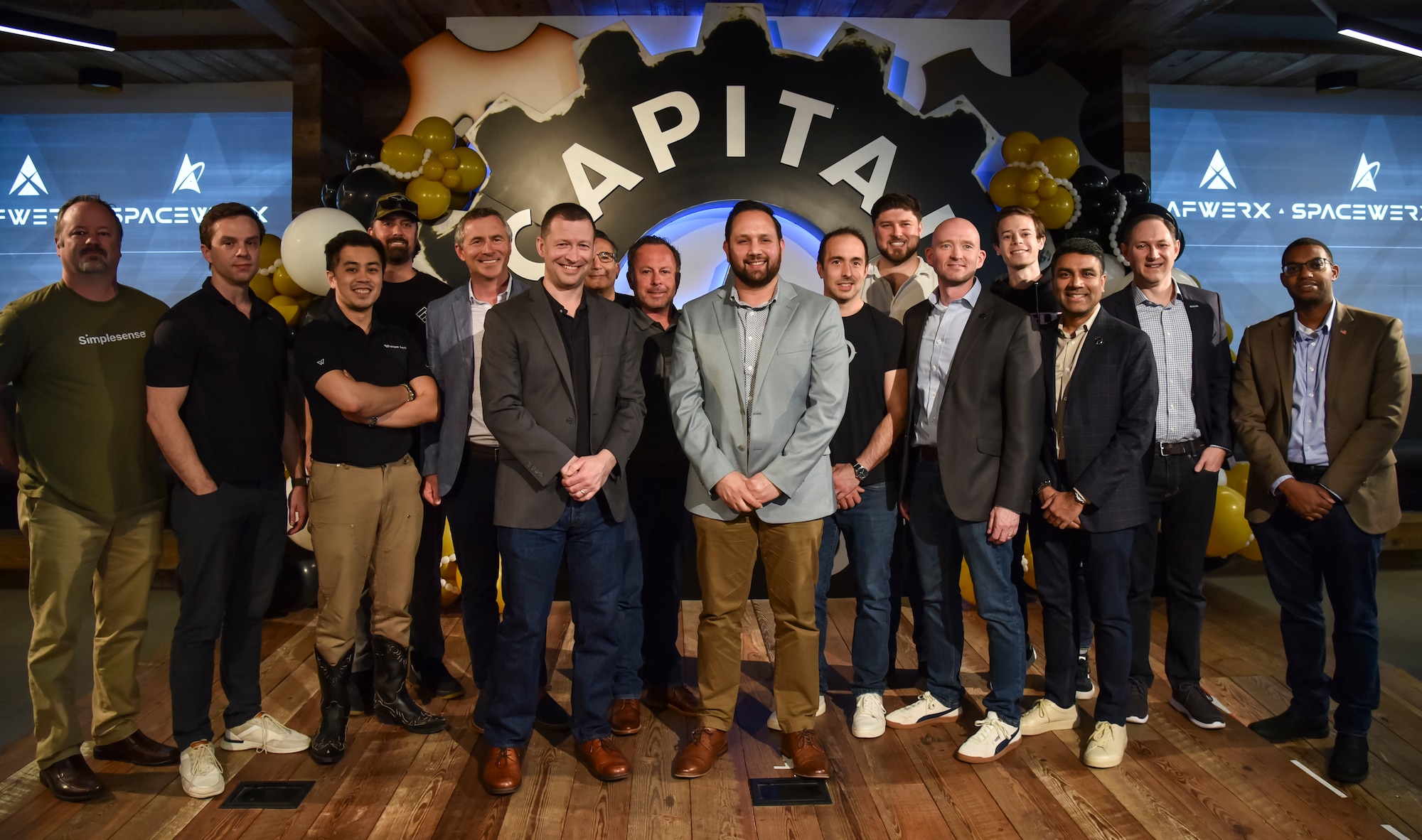 Col. Elliott Leigh, AFWERX director and chief commercialization officer for the Department of the Air Force, and Arthur Grijalva, SpaceWERX director, pose with industry partners and select recipients of the Program Year 2025.1 Strategic Funding Increase (STRATFI) from Phase II eligible applicants at Capital Factory House in Austin, Texas, March 8, 2025. STRATFI helps bridge the gap between innovation and operational use by providing $3 million to $15 million per project to scale emerging technologies. By connecting private-sector innovators, defense stakeholders, and investors, STRATFI strengthens the defense industrial base and accelerates the transition of advanced capabilities to the warfighter. (U.S. Air Force photo by Matthew Clouse)