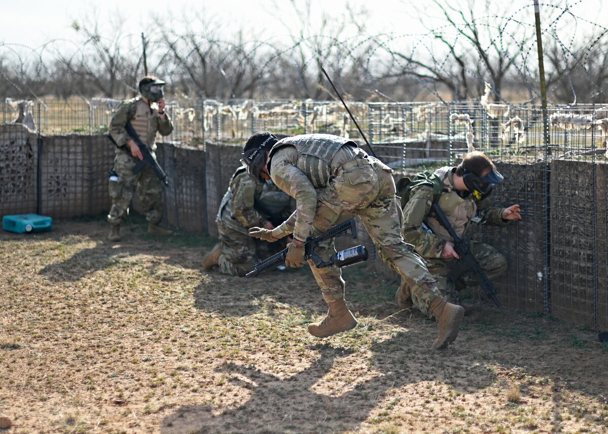 An Angelo State University ROTC Air Force Detachment 847 cadet runs to reload his weapon during a simulated base defense operation at the field training exercise on Goodfellow Air Force Base, Texas, March 7, 2025. Cadets worked together to call out attacks and coordinate their actions to successfully defend their position. (U.S. Air Force photo by Staff Sgt. Ethan Sherwood)