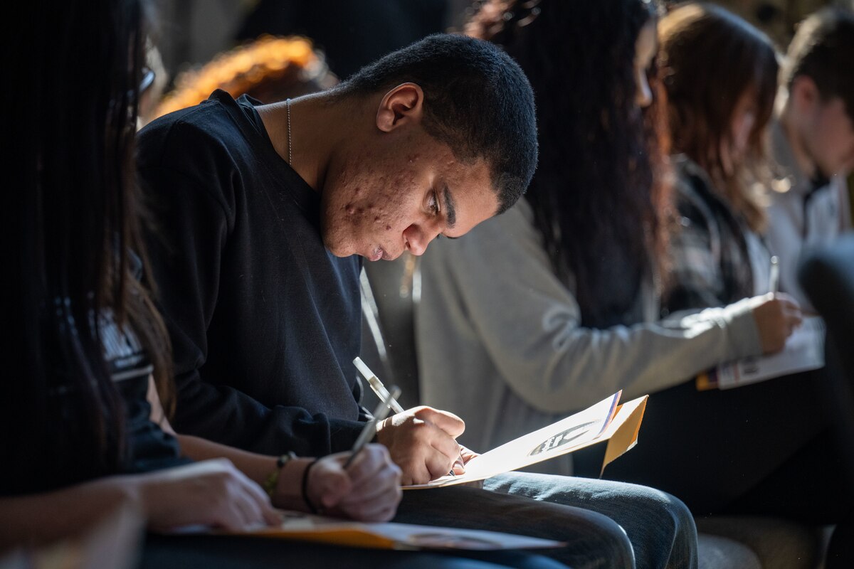 A future service member solidifies their commitment to the United States military with a signature at the Ohio Military Signing Day at the National Veterans Memorial Museum in Columbus, Ohio, March 11, 2025