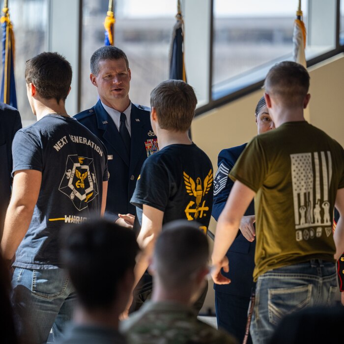 Col. Dustin Richards, 88th Air Base Wing and Installation Commander, coagulates junior and senior high school students from 80 schools committing to Military service at the Ohio Military Signing Day at the National Veterans Memorial Museum in Columbus, Ohio, March 11, 2025