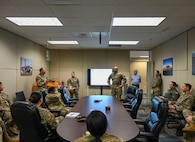 Chief Master Sgt. Jonathan Birk, front center, the 433rd Airlift Wing command chief, participates in a First Sergeants Council “Coffee and Conversation” session at Joint Base San Antonio-Lackland, Texas, March 1, 2025.