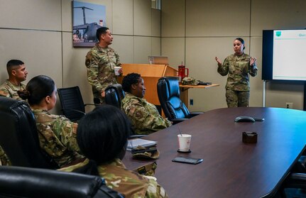 Master Sgt. Celine Cordova, front-center, 68th Airlift Squadron first sergeant, facilitates discussion for attendees during the First Sergeant Council’s “Coffee and Conversations” event at Joint Base San Antonio-Lackland, Texas, March 1, 2025.